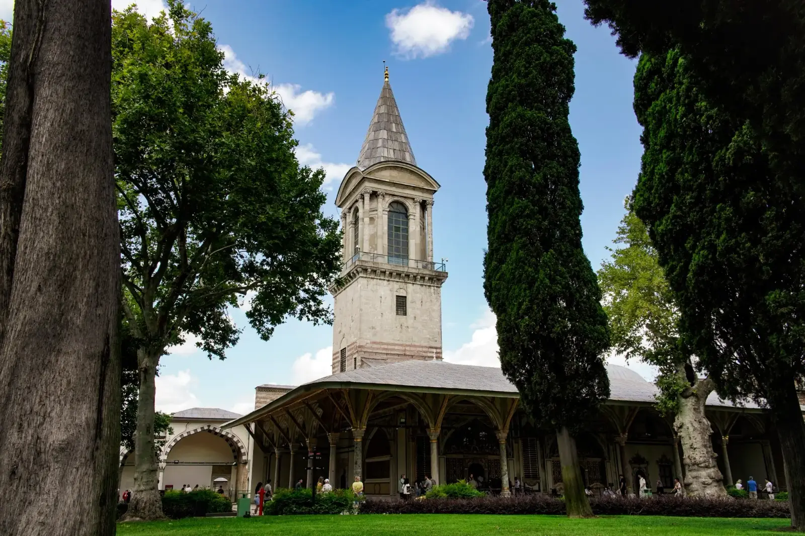 Cypress trees framing the Tower of Justice in the courtyard of Topkapı Palace